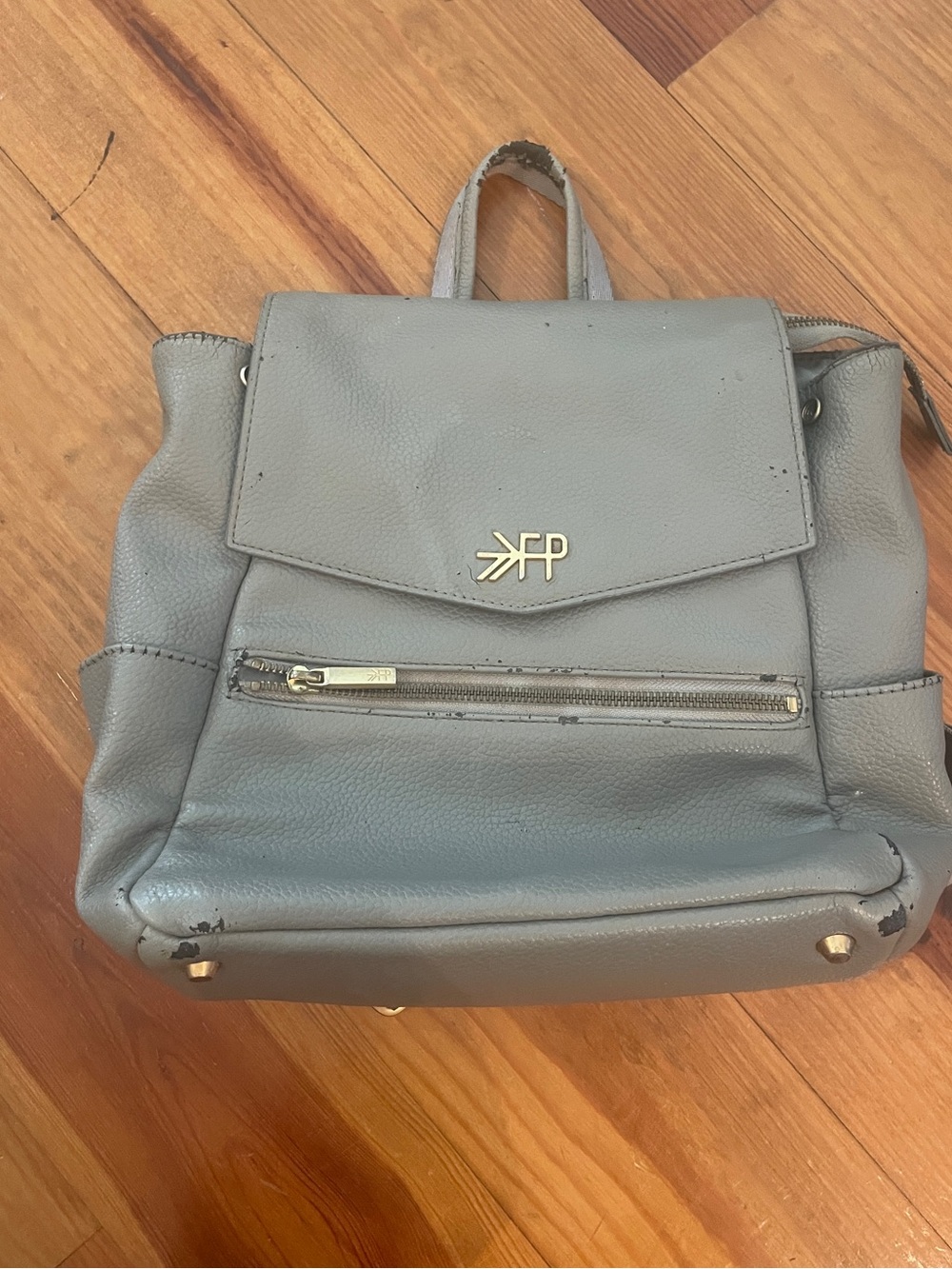 Freshly Picked Gray Leather Backpack with Front Zip and Logo